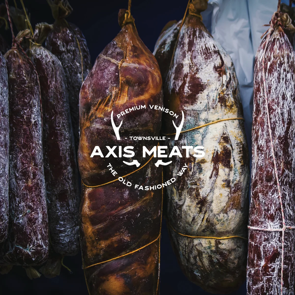 Axis Meats logo over cured meats